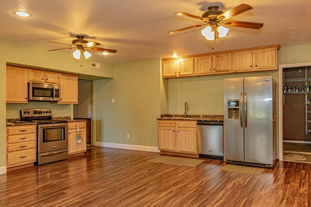 3520 Blue Springs Road Sweetwater, TN 37874 - Photo 11 of 49 a kitchen with stainless steel appliances granite countertop a refrigerator a stove top oven a sink and dishwasher