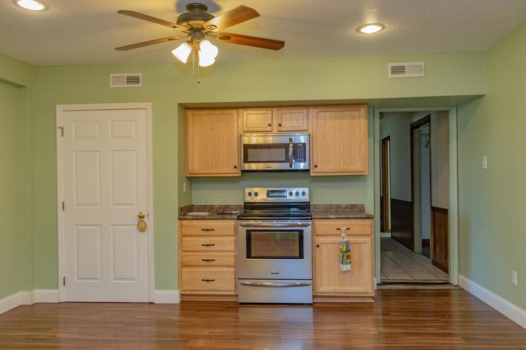 3520 Blue Springs Road Sweetwater, TN 37874 - Photo 13 of 49 a kitchen with stainless steel appliances granite countertop a stove and a microwave