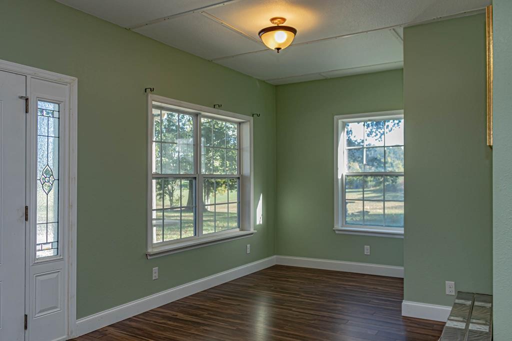 3520 Blue Springs Road Sweetwater, TN 37874 - Photo 14 of 49 a view of an empty room with wooden floor and a window
