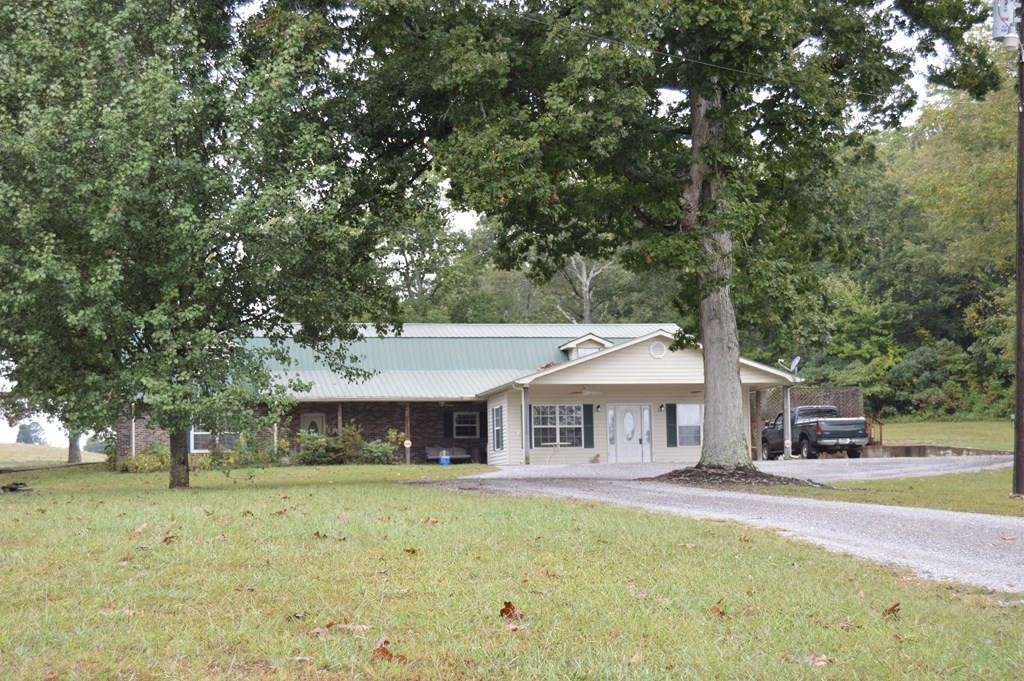 3520 Blue Springs Road Sweetwater, TN 37874 - Photo 3 of 49 a front view of a house with a garden
