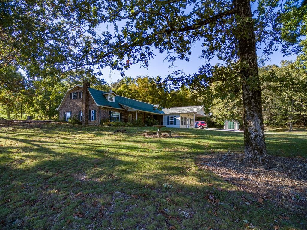 3520 Blue Springs Road Sweetwater, TN 37874 - Photo 41 of 49 a front view of a house with a garden