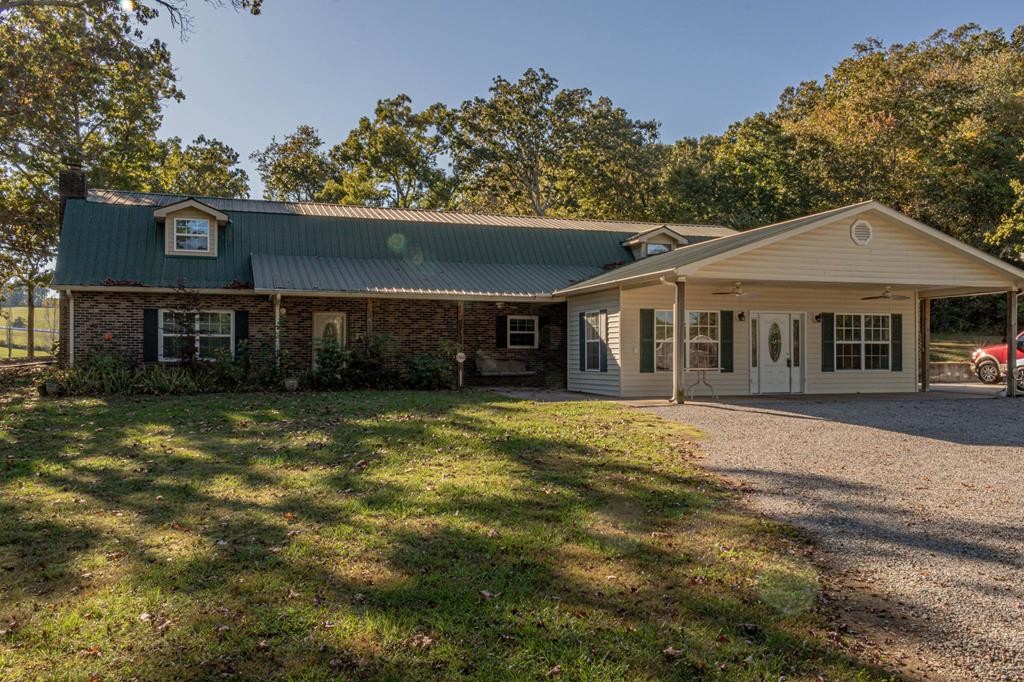 3520 Blue Springs Road Sweetwater, TN 37874 - Photo 47 of 49 a front view of a house with a garden