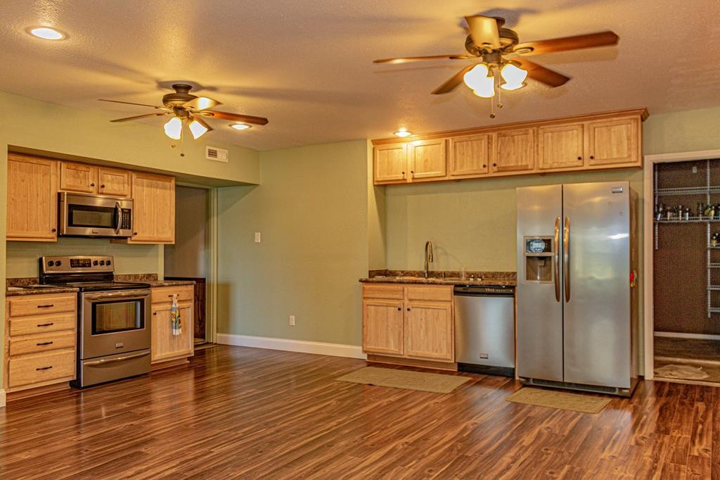 3520 Blue Springs Road Sweetwater, TN 37874 - Photo 10 of 49 a kitchen with stainless steel appliances granite countertop a refrigerator a stove and a microwave