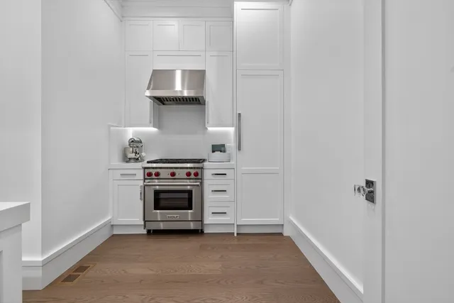 a kitchen with a stove and a cabinet
