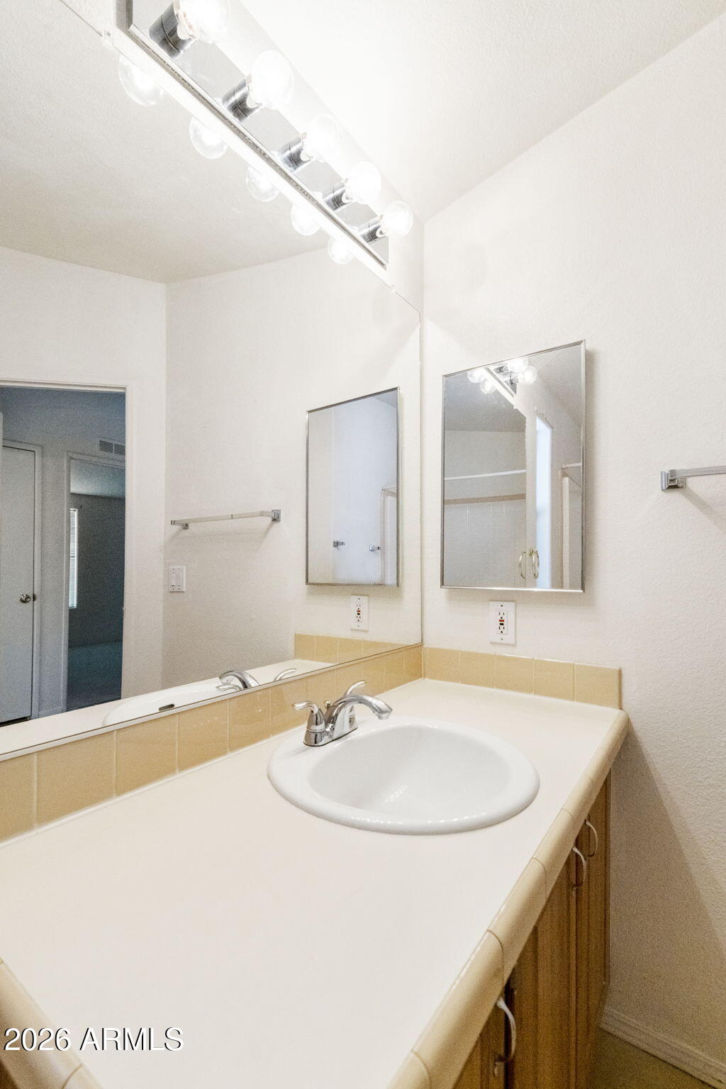 3700 South Tomahawk Road, Unit 73 Apache Junction, AZ 85119 - Photo 9 of 49 a bathroom with a sink and a mirror