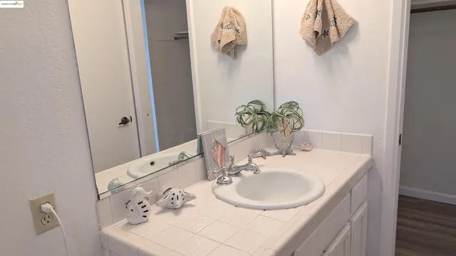 a bathroom with a window and a shower