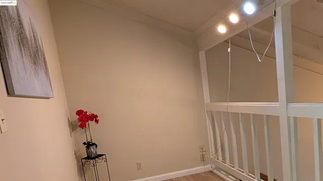 a view of an empty room and wooden floor