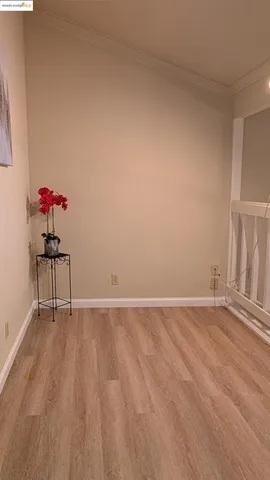 a view of a room with a door and a window