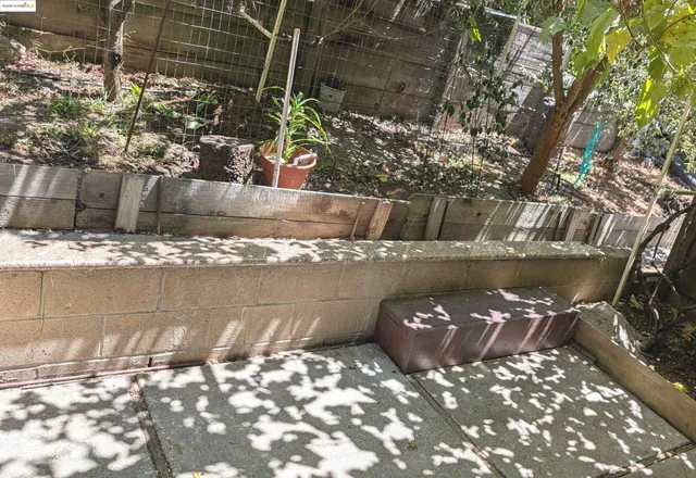 a view of a water fountain and a bench