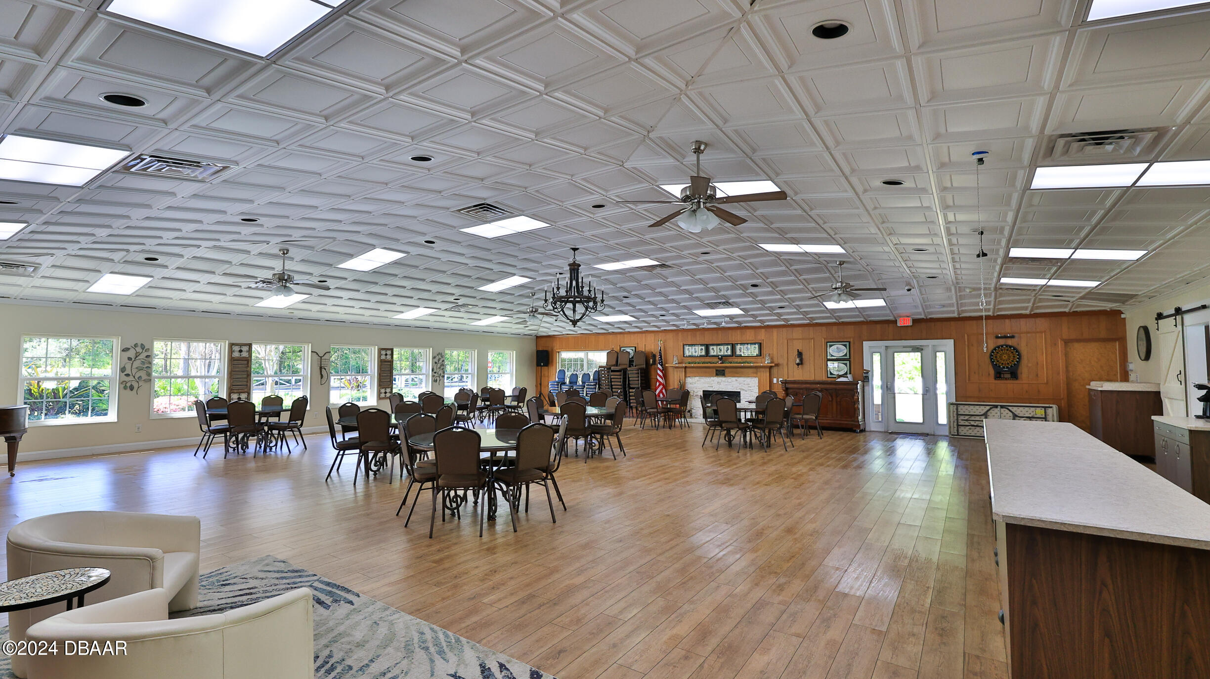 16 Meadow Ridge View Ormond Beach, FL 32174 - Photo 44 of 45 a view of a room with lots of chairs and a chandelier