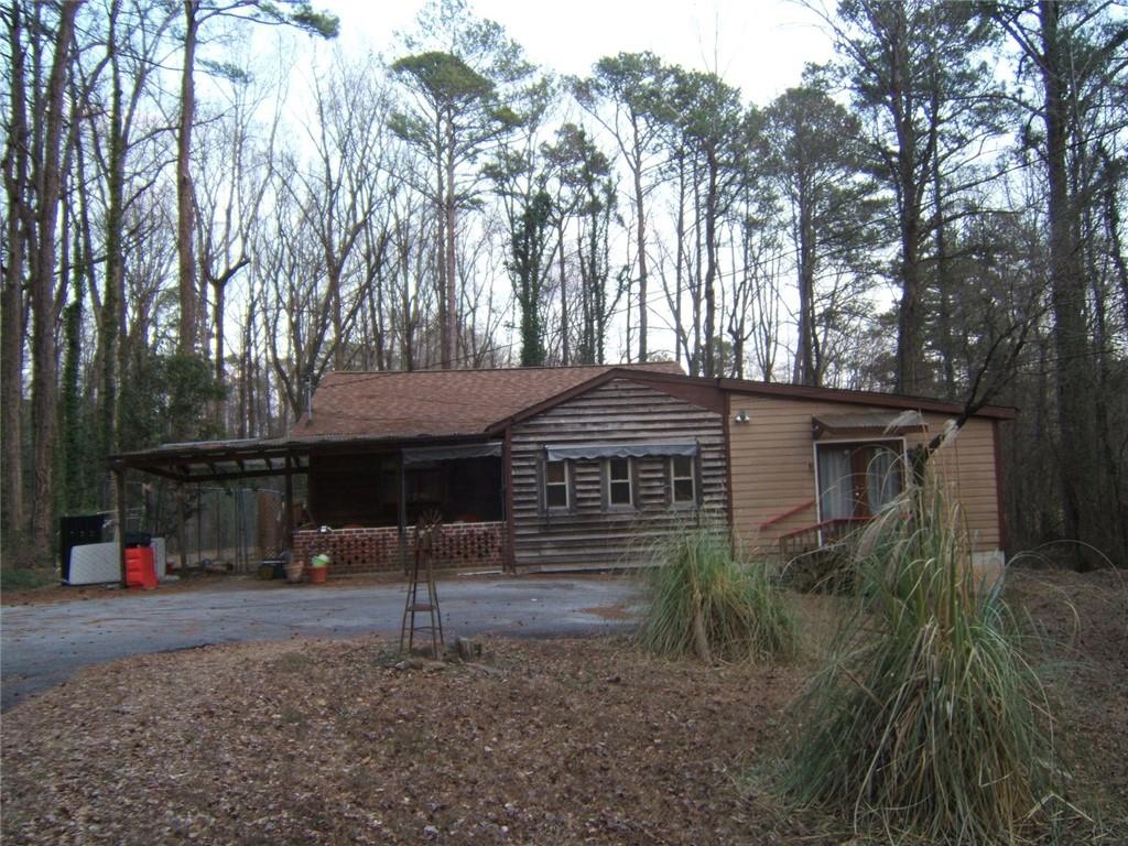 2026 Kimberly Road Southwest Atlanta, GA 30331 - Photo 2 of 11 a front view of a house with a yard