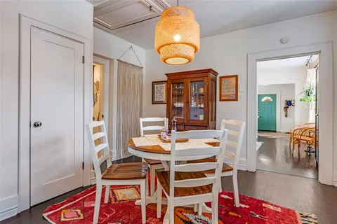 a dining room with furniture and a window