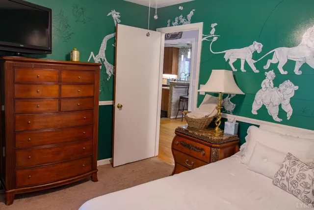 a bathroom with a toilet and a window