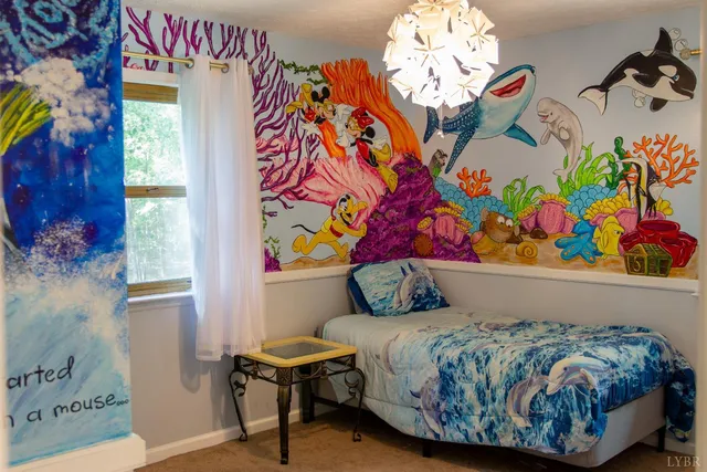 a bedroom with a bed and a painting on the wall