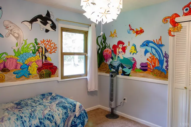 a bathroom with a sink a mirror and painting on the wall