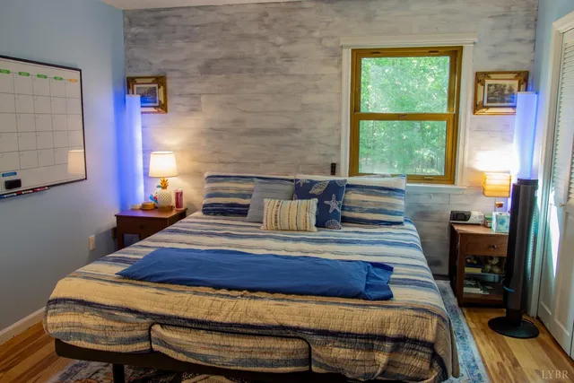 a bedroom with a bed and a dresser