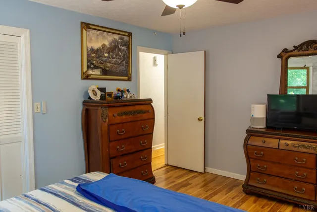 a bathroom with a toilet a sink and a mirror