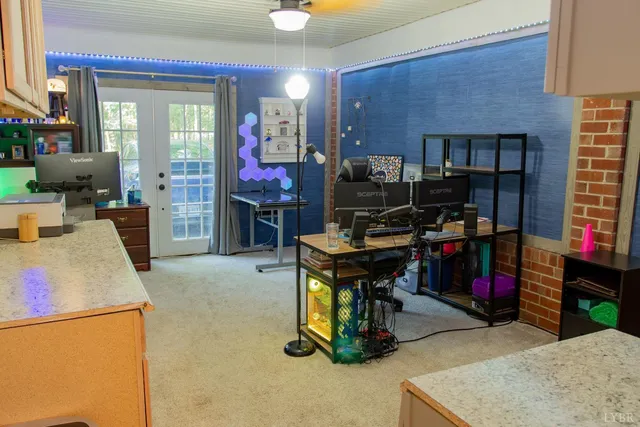 a view of a workspace with furniture