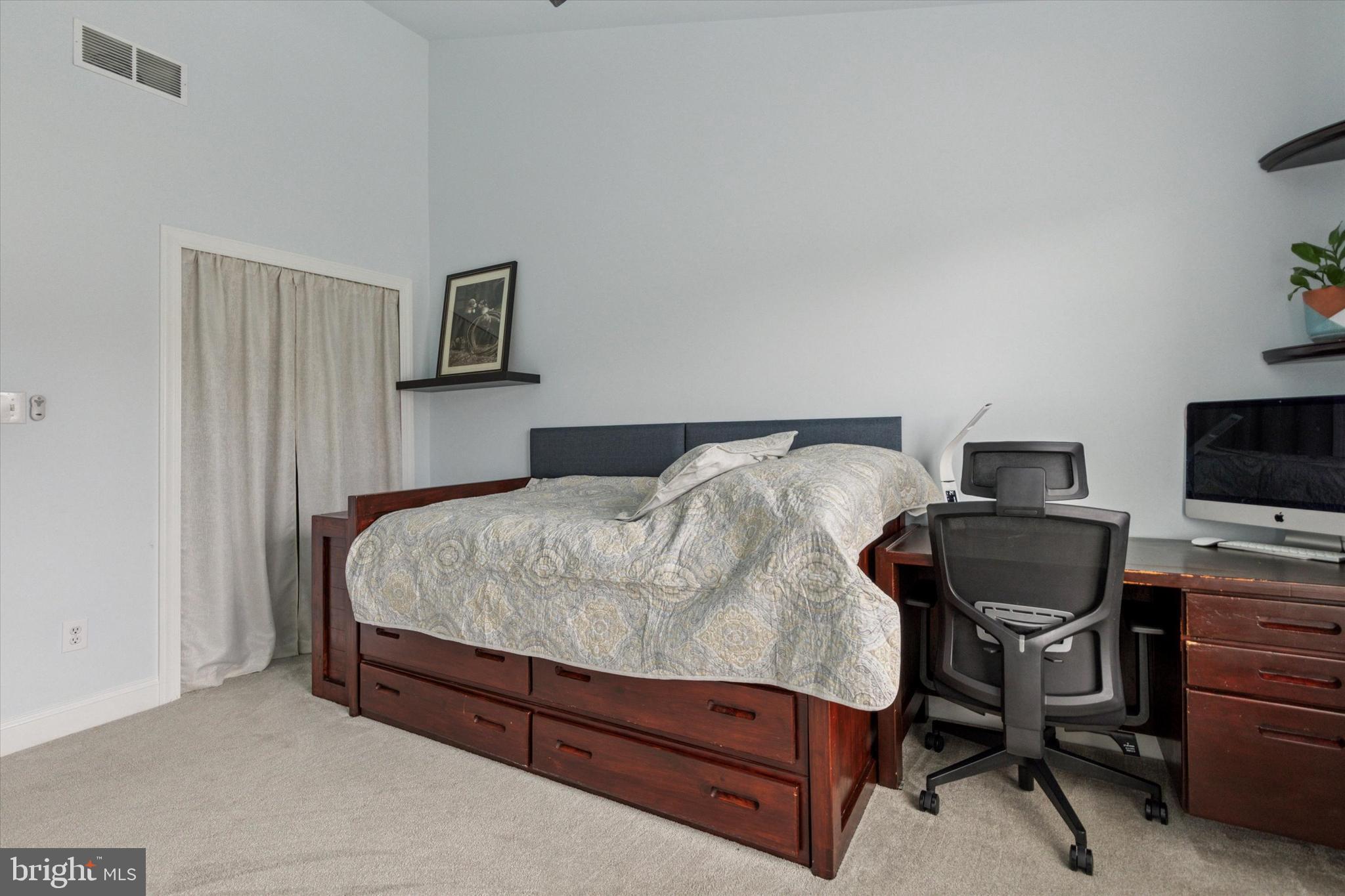 3229 Meadow View Circle, Unit 157 Furlong, PA 18925 - Photo 17 of 28 a bedroom with a bed and chair