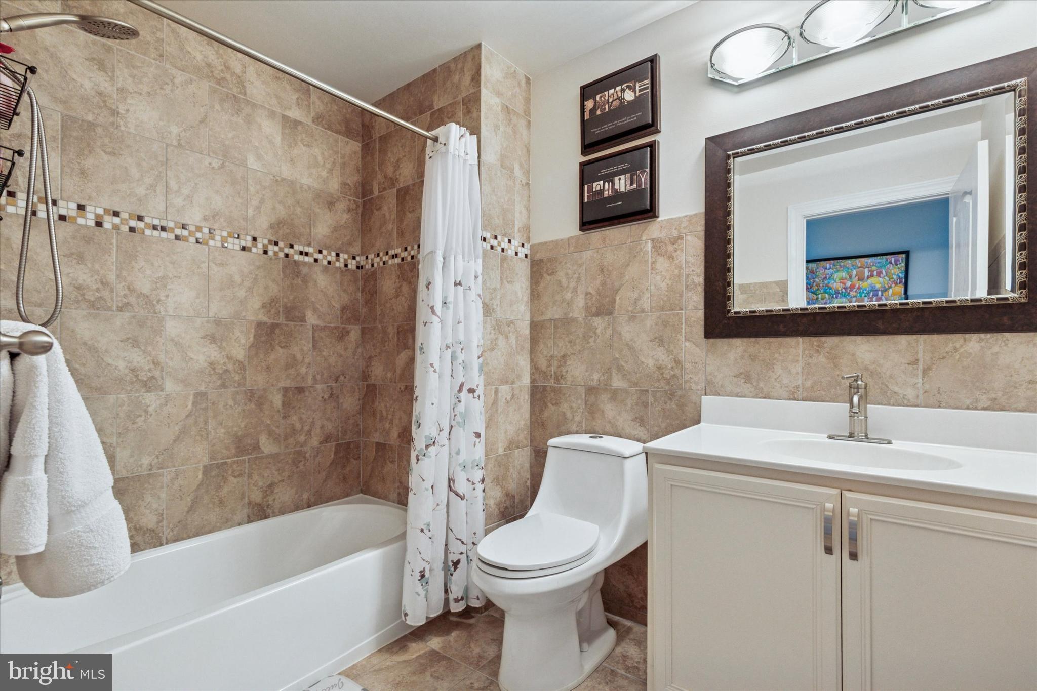 3229 Meadow View Circle, Unit 157 Furlong, PA 18925 - Photo 18 of 28 a bathroom with a sink toilet and shower