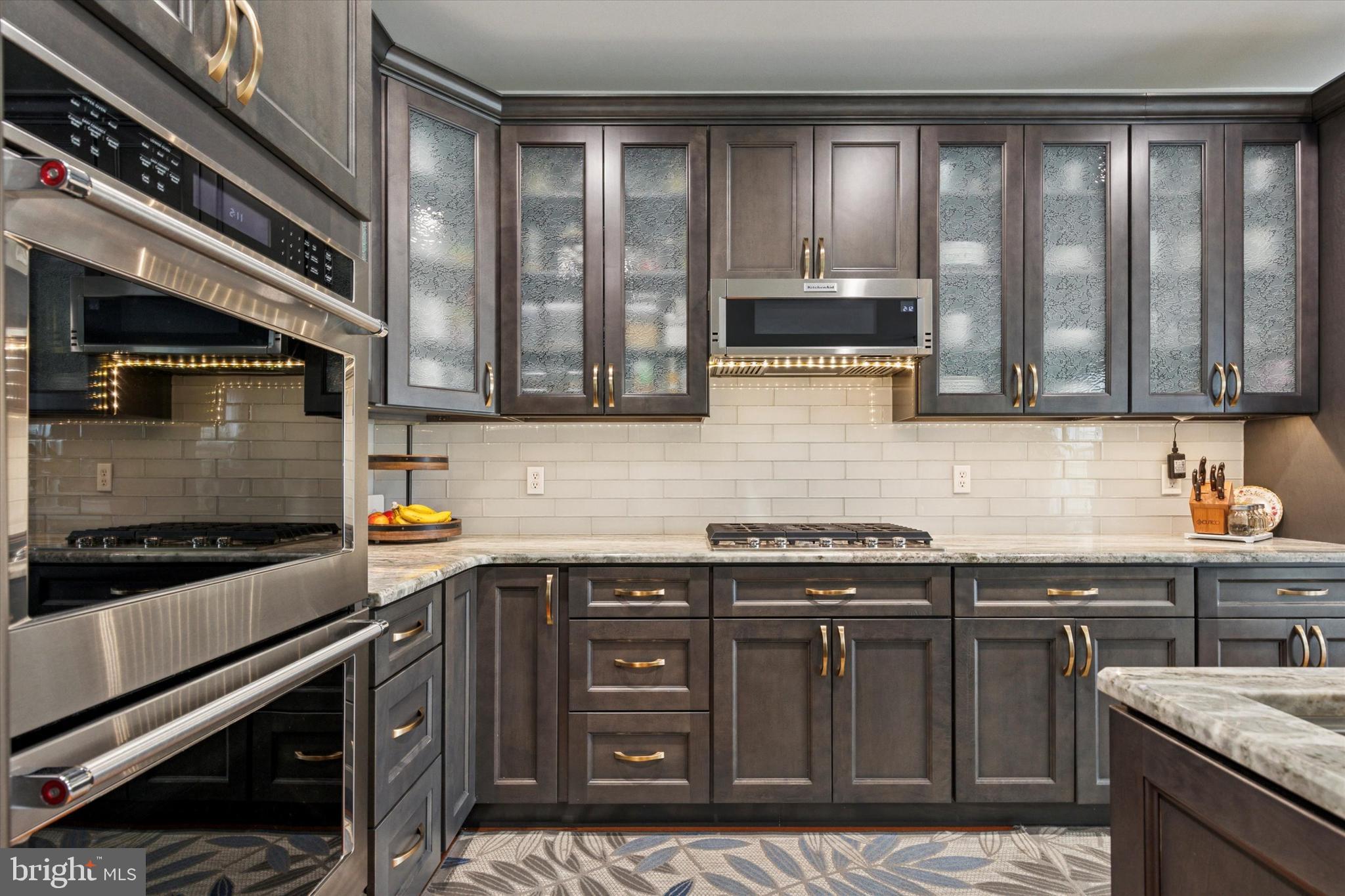 3229 Meadow View Circle, Unit 157 Furlong, PA 18925 - Photo 10 of 28 a kitchen with stainless steel appliances granite countertop a sink stove and cabinets