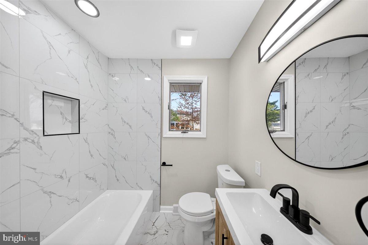 24 Vansant Road Newark, DE 19711 - Photo 21 of 44 a bathroom with a sink and a mirror