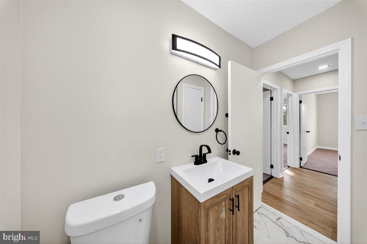 24 Vansant Road Newark, DE 19711 - Photo 22 of 44 a bathroom with a sink and a mirror