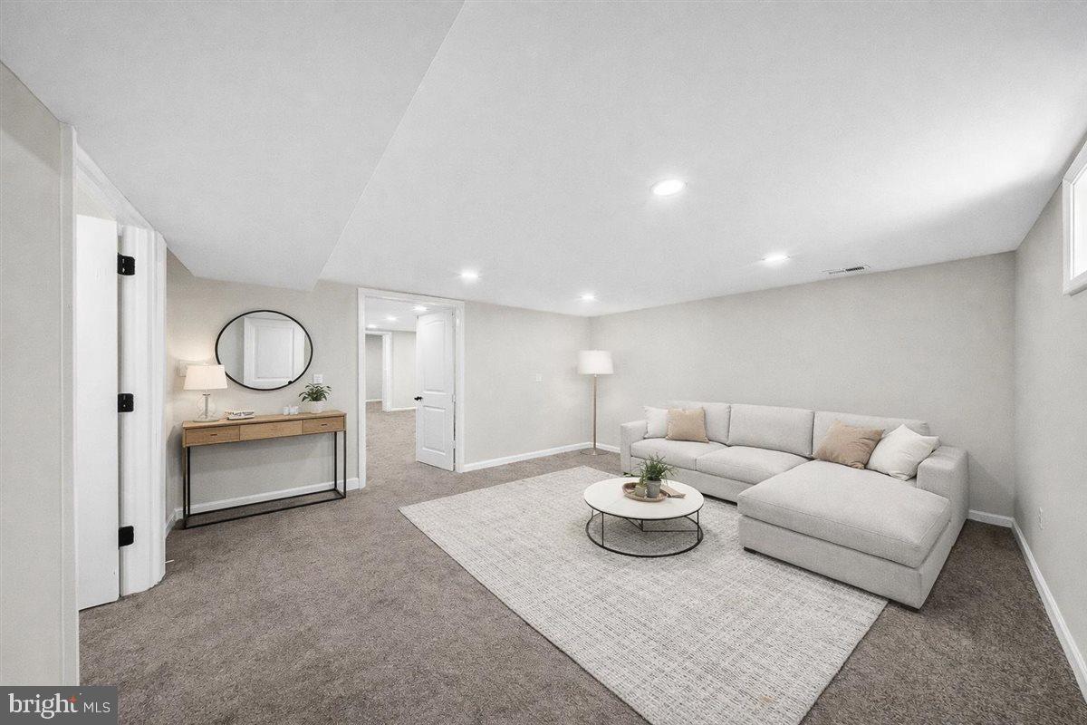 24 Vansant Road Newark, DE 19711 - Photo 23 of 44 a living room with furniture a rug and white walls