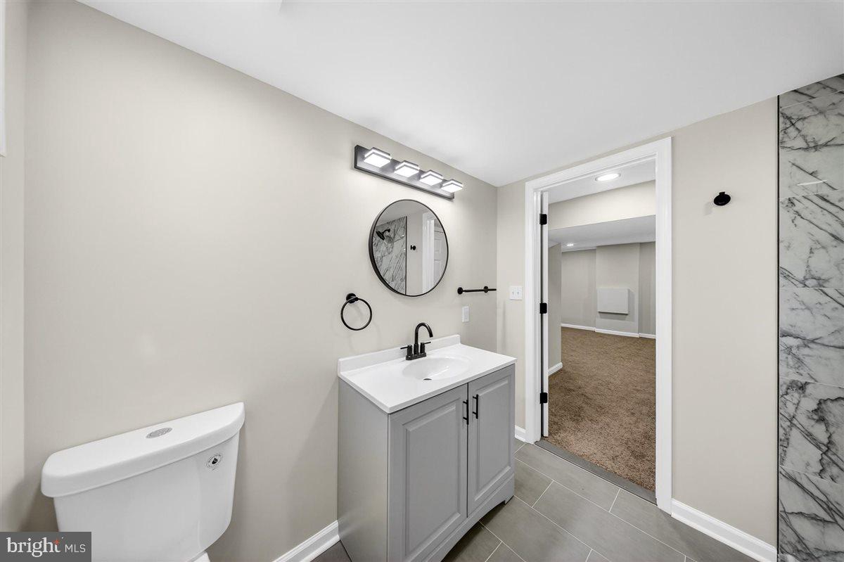 24 Vansant Road Newark, DE 19711 - Photo 32 of 44 a bathroom with a sink and a mirror