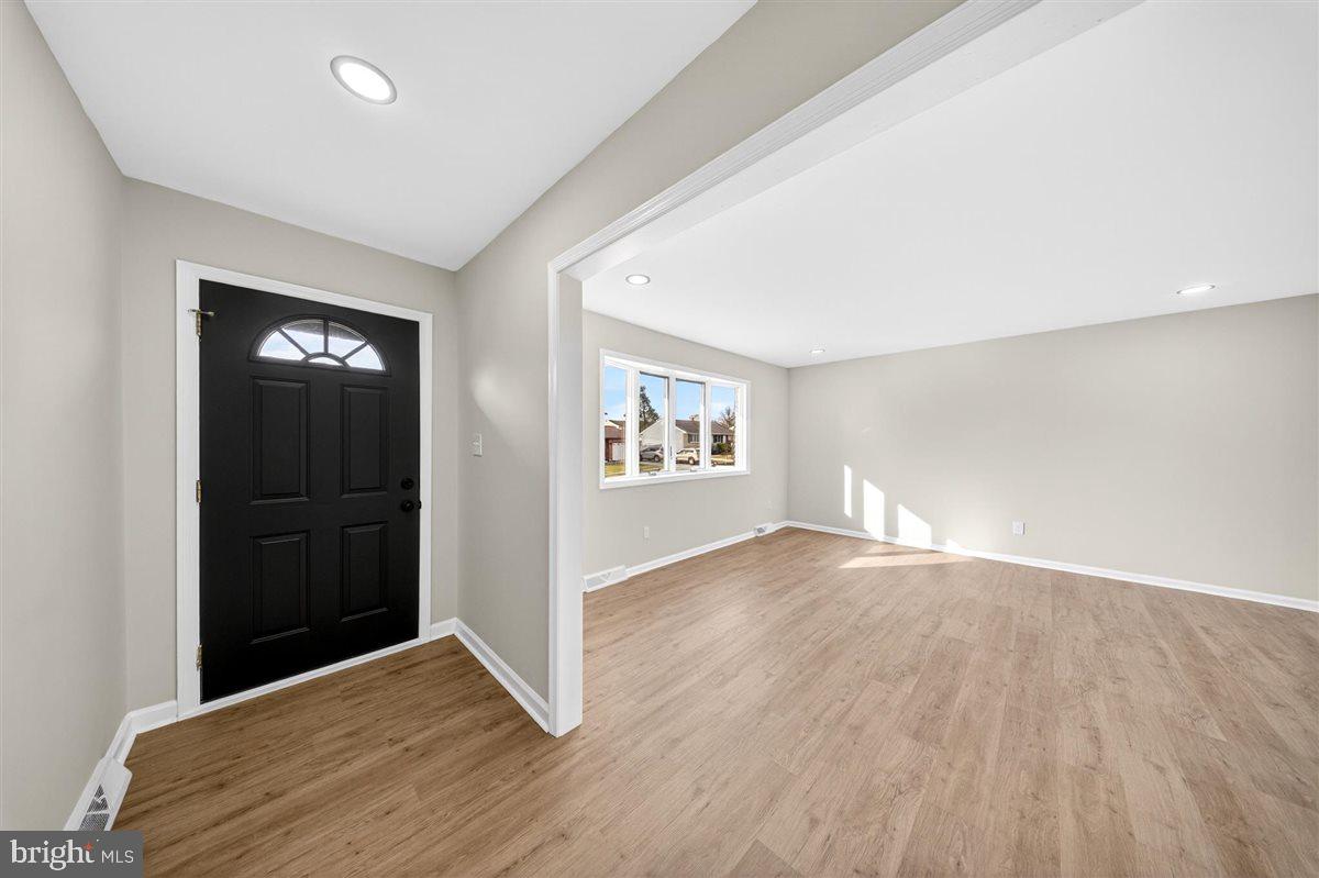 24 Vansant Road Newark, DE 19711 - Photo 4 of 44 wooden floor in an empty room with a window