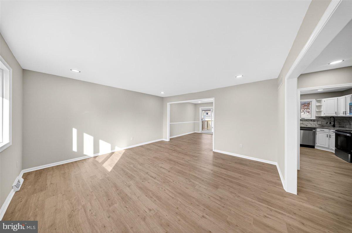 24 Vansant Road Newark, DE 19711 - Photo 8 of 44 a view of empty room with wooden floor