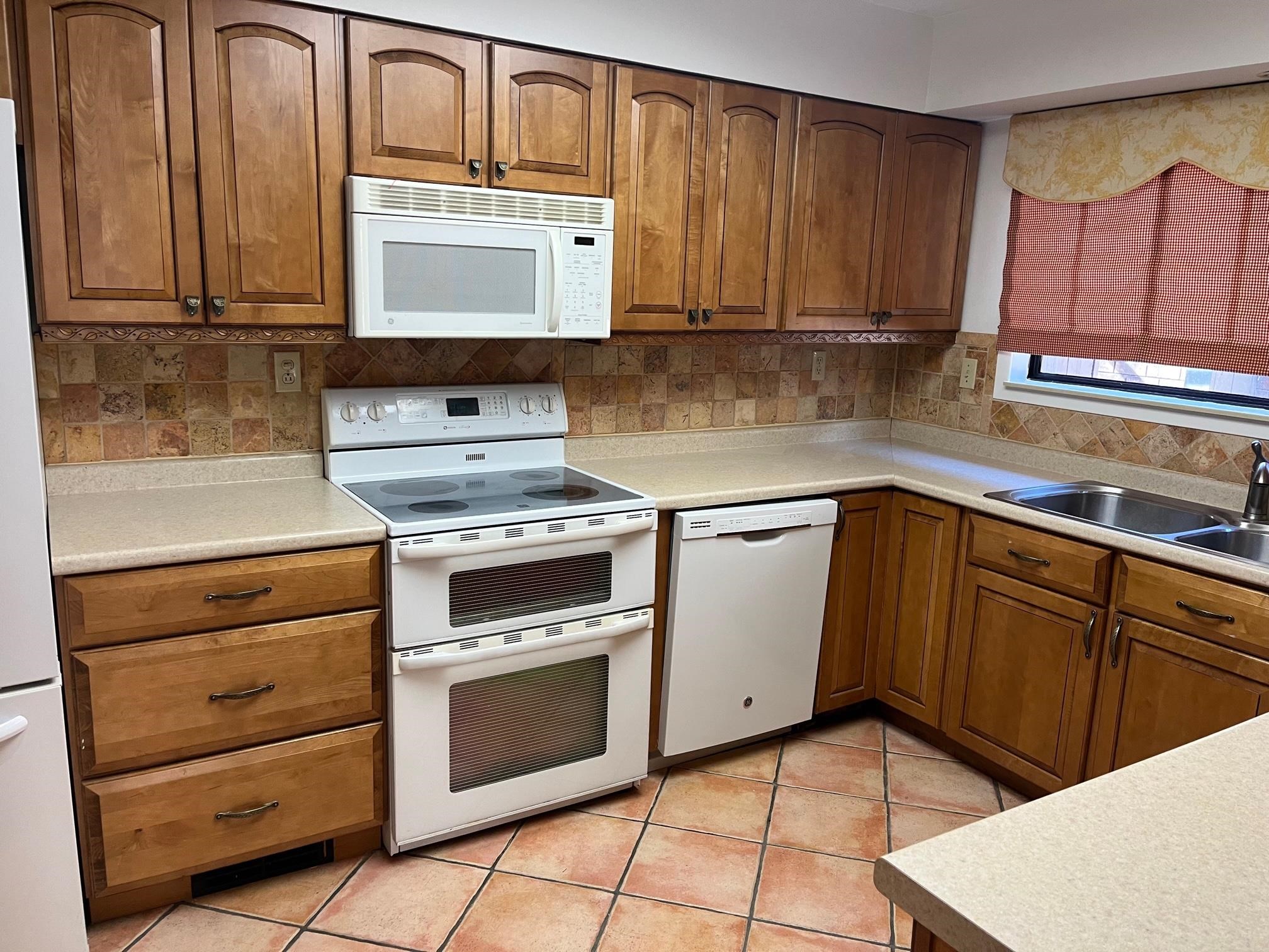 6536 Cherryhill Ridge Memphis, TN 38120 - Photo 6 of 8 a kitchen with granite countertop cabinets stainless steel appliances and a sink