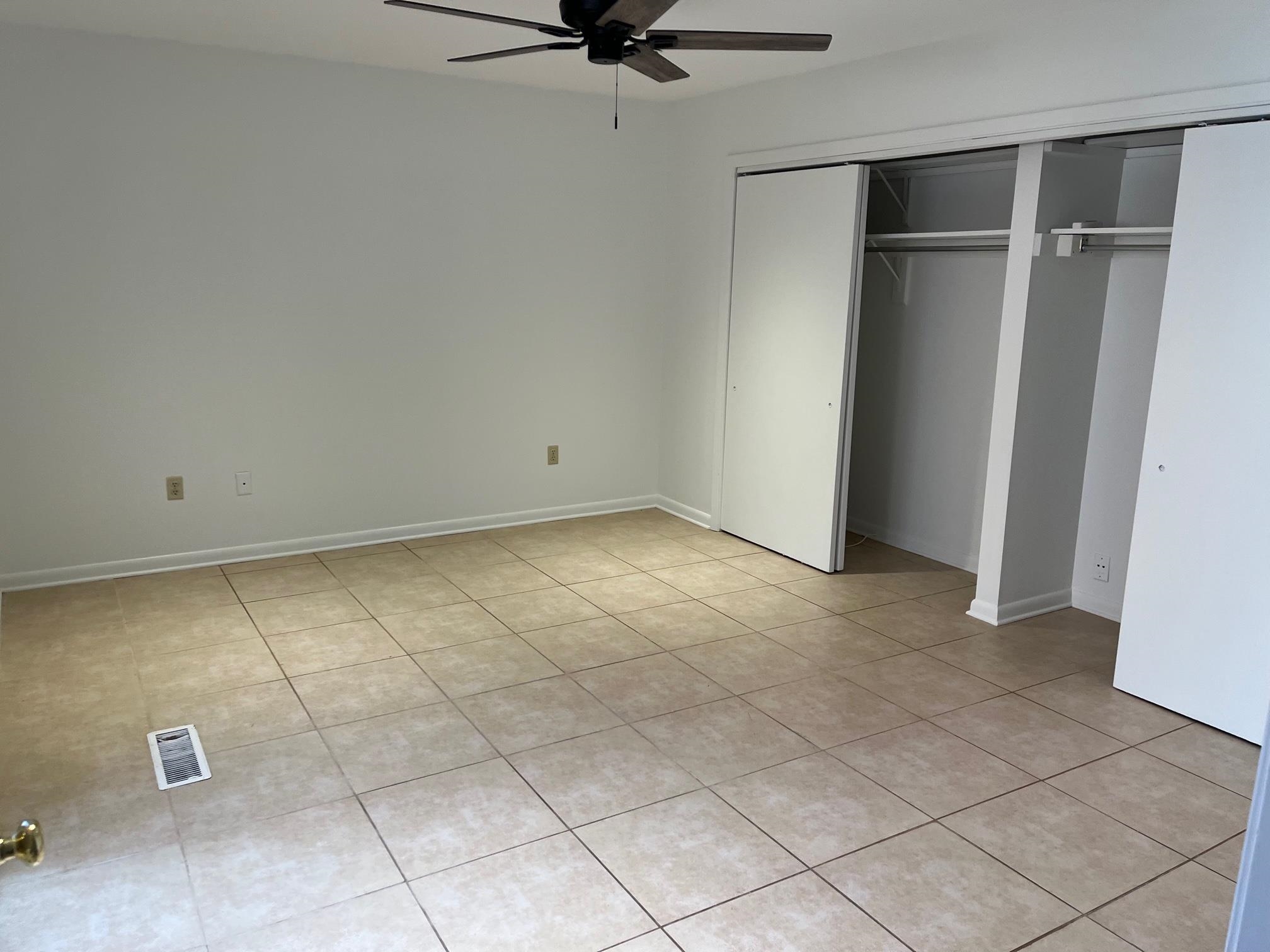 6536 Cherryhill Ridge Memphis, TN 38120 - Photo 7 of 8 a view of an empty room with a ceiling fan