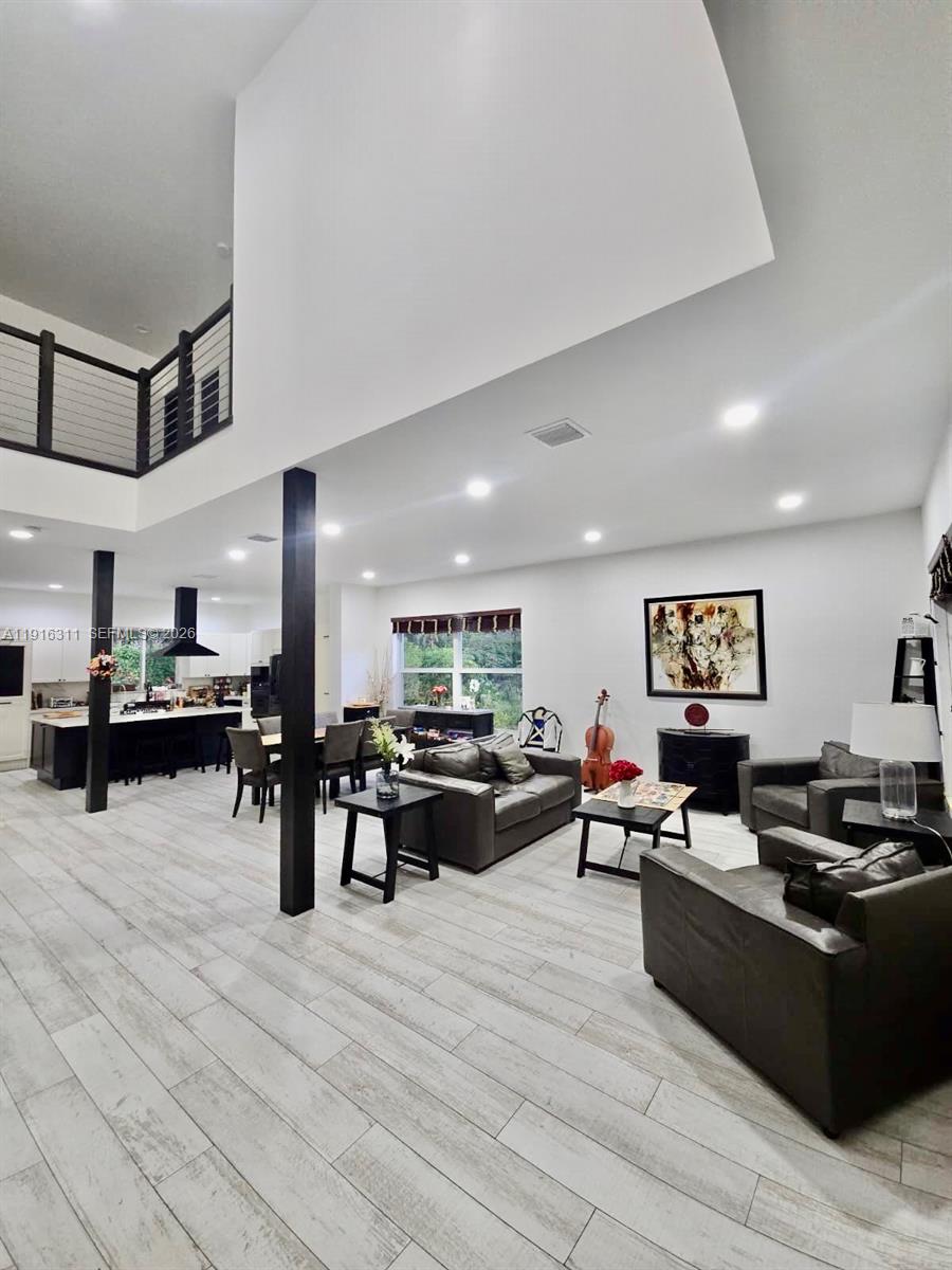 2019 Harbor View Circle Weston, FL 33327 - Photo 1 of 29 a living room with furniture and kitchen view