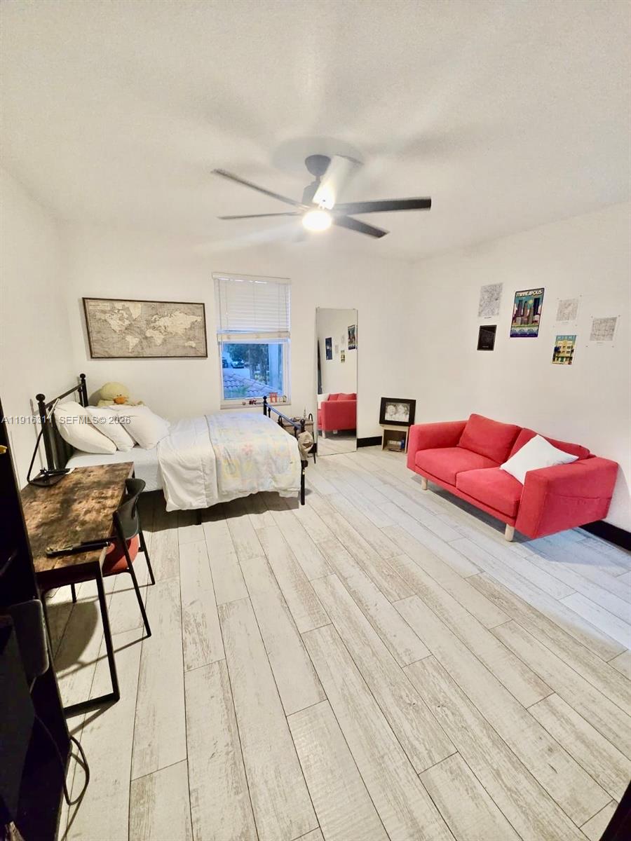 2019 Harbor View Circle Weston, FL 33327 - Photo 11 of 29 a bedroom with furniture and a chandelier