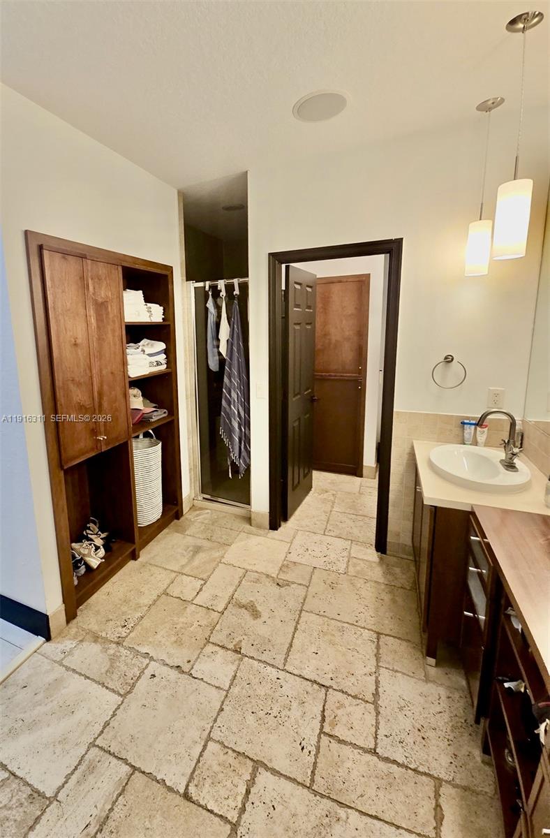 2019 Harbor View Circle Weston, FL 33327 - Photo 26 of 29 a room with a bed and a sink mirror