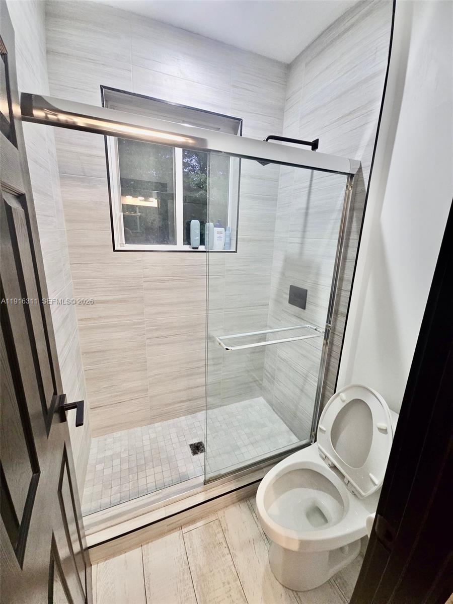 2019 Harbor View Circle Weston, FL 33327 - Photo 27 of 29 a bathroom with a shower and toilet