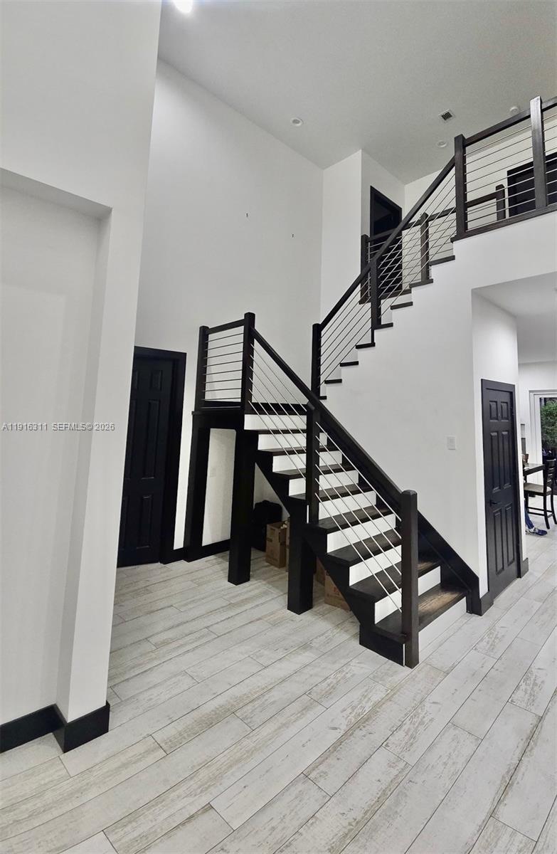 2019 Harbor View Circle Weston, FL 33327 - Photo 28 of 29 a view of entryway and hall with wooden floor