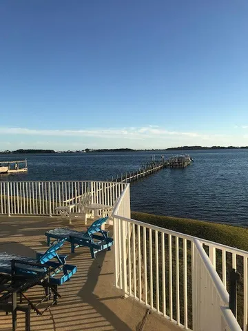 a view of balcony with floor to ceiling windows
