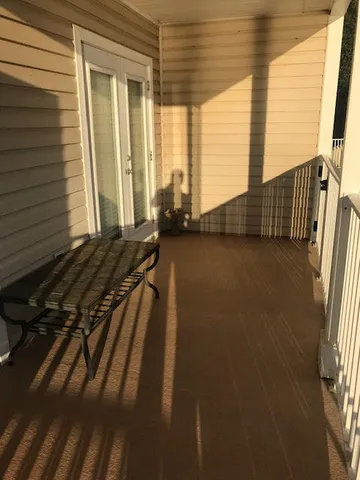 a view of a balcony with chairs