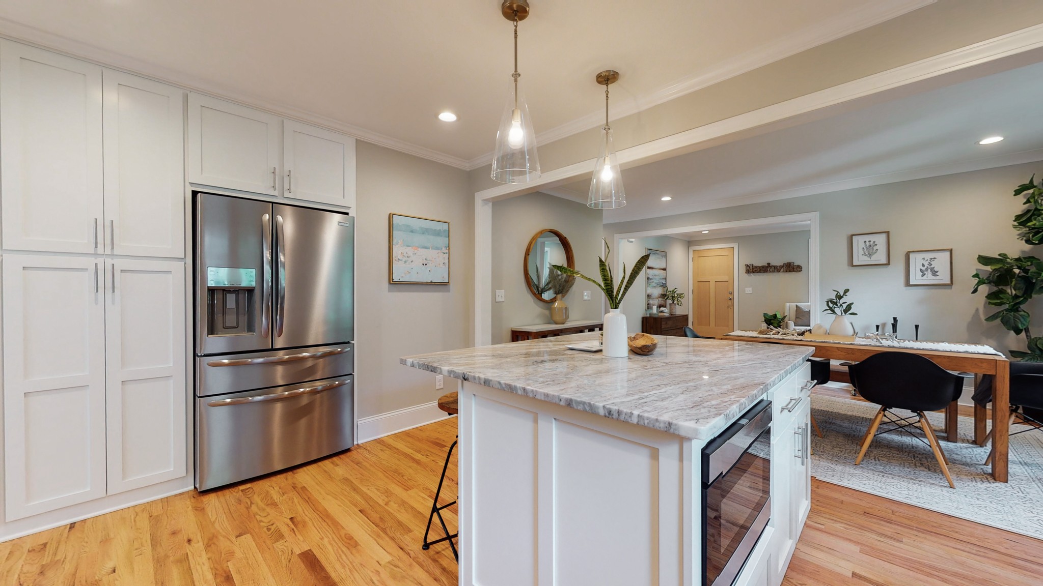 4109 Murphy Road Nashville, TN 37209 - Photo 12 of 31 a kitchen with stainless steel appliances granite countertop a refrigerator a stove and a sink with wooden floor