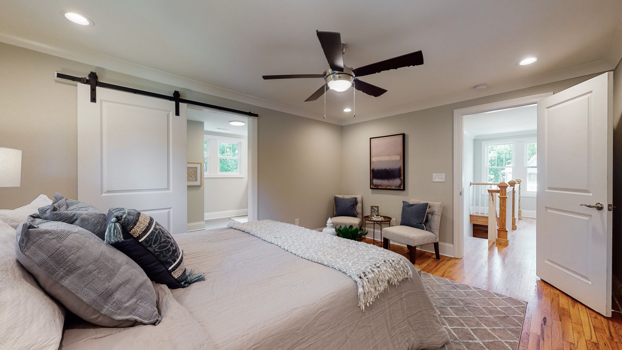 4109 Murphy Road Nashville, TN 37209 - Photo 18 of 31 a bedroom with a large bed and a chandelier