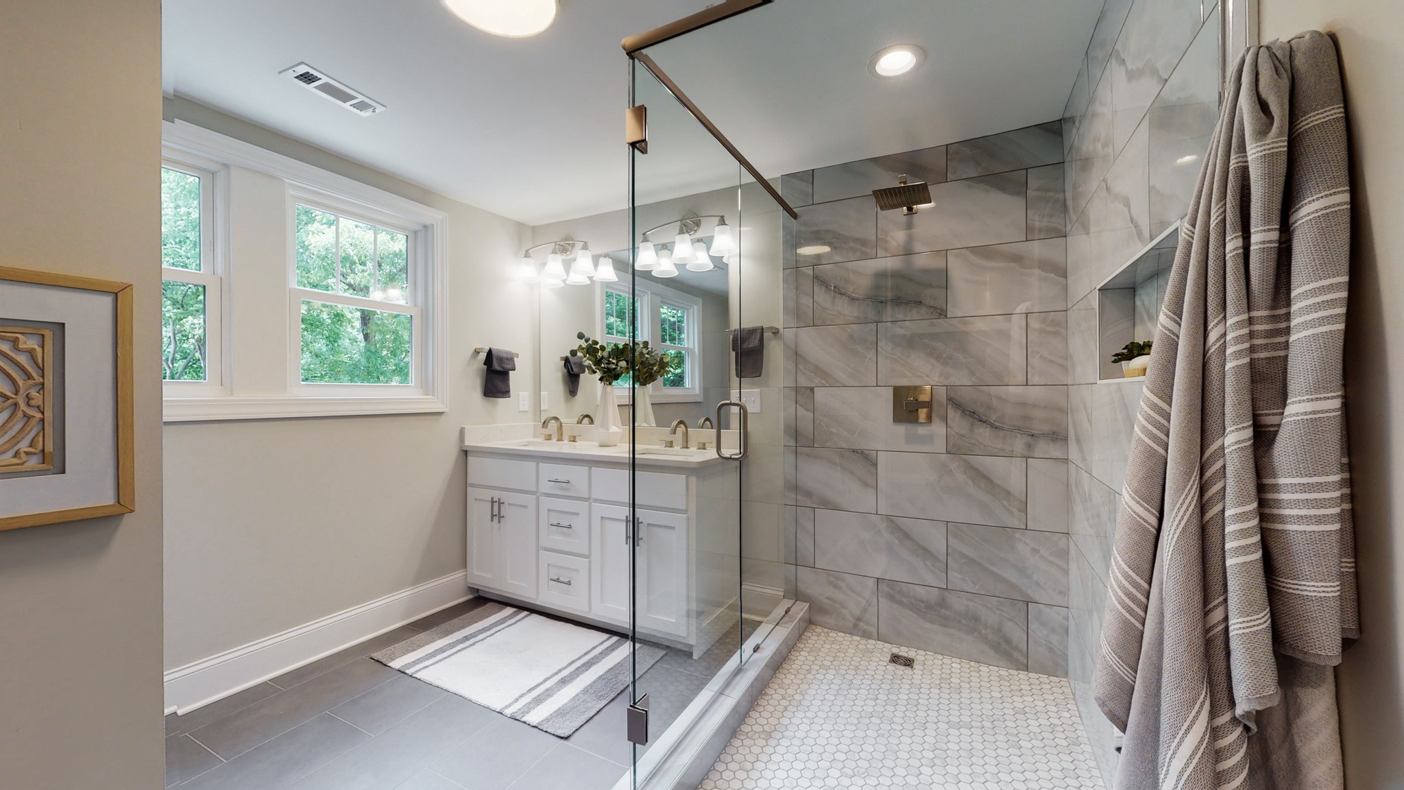 4109 Murphy Road Nashville, TN 37209 - Photo 19 of 31 a bathroom with a double vanity sink toilet and shower