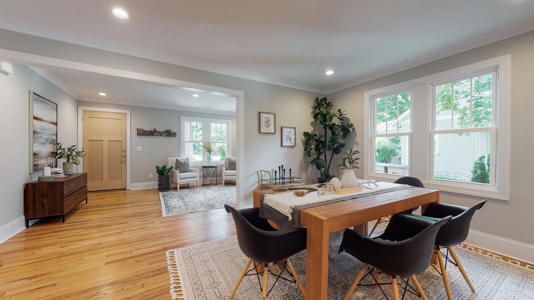 4109 Murphy Road Nashville, TN 37209 - Photo 6 of 31 a view of a dining room with furniture and wooden floor
