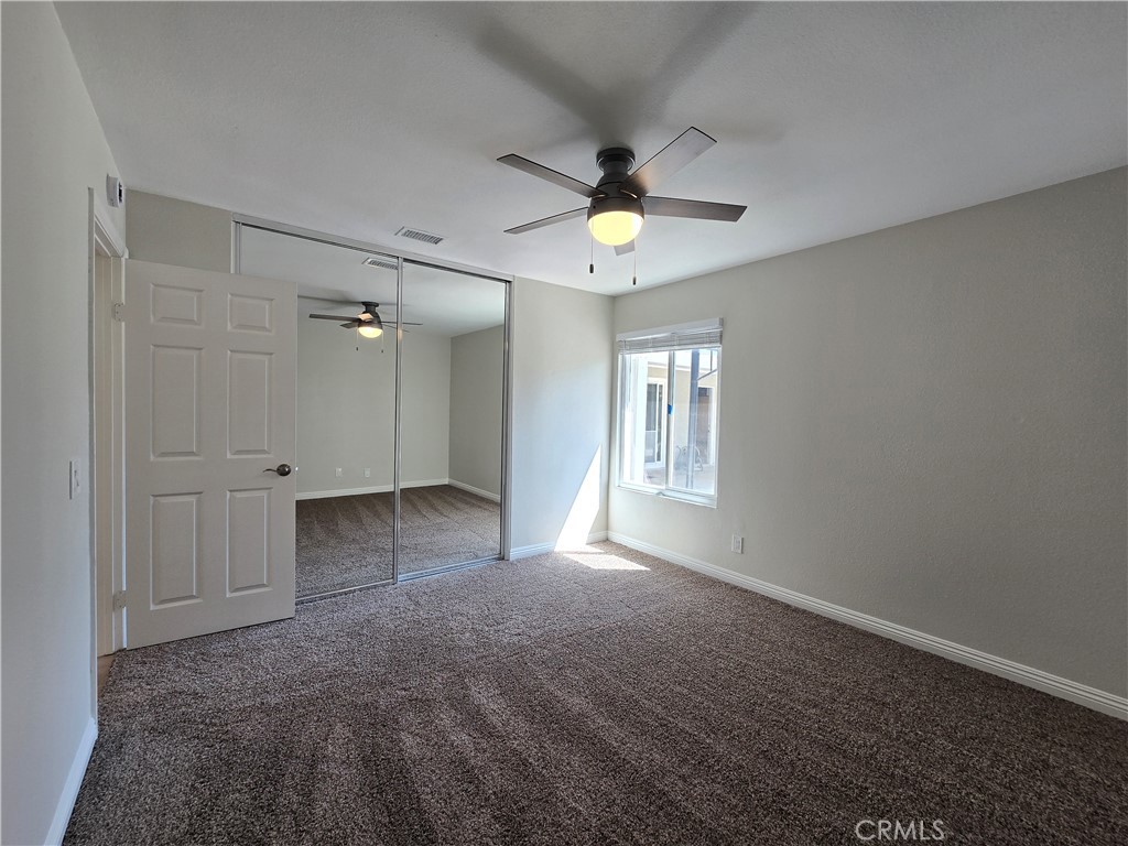 6846 Barkwood Road Riverside, CA 92506 - Photo 13 of 27 wooden floor in an empty room with a window