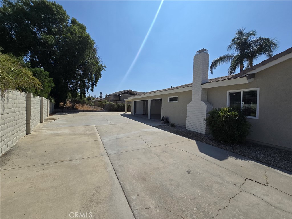 6846 Barkwood Road Riverside, CA 92506 - Photo 20 of 27 a view of a house with a backyard