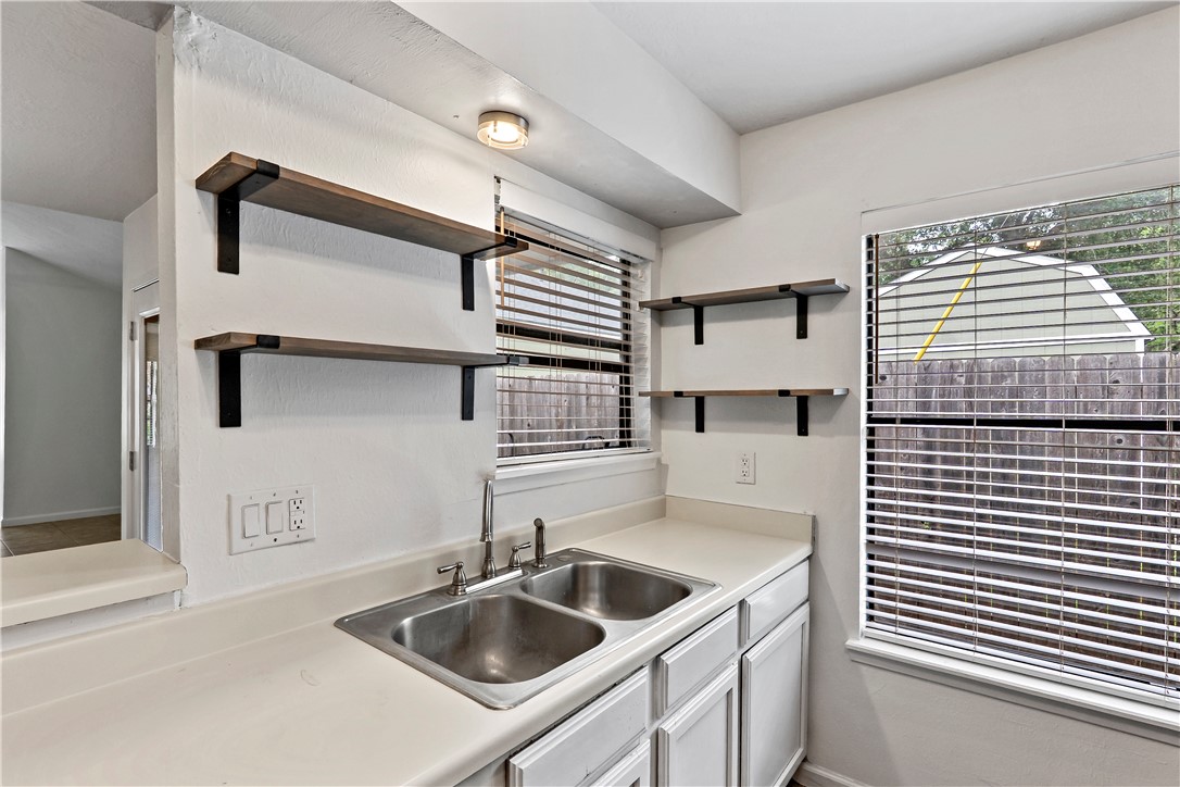 2208 Lobo Drive Bryan, TX 77807 - Photo 13 of 23 a kitchen with a sink and cabinets