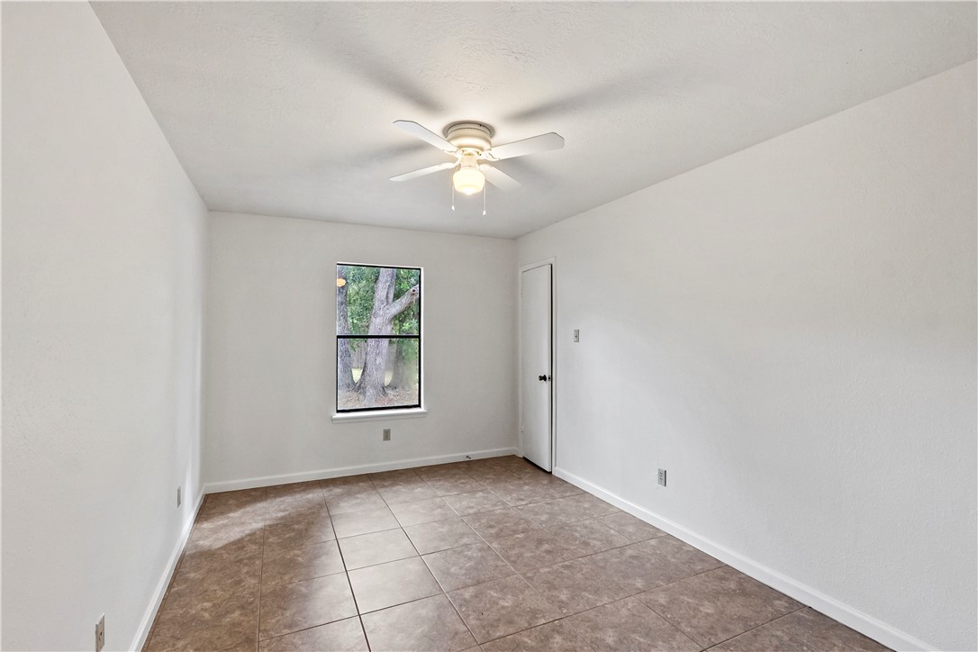 2208 Lobo Drive Bryan, TX 77807 - Photo 17 of 23 a view of an empty room with a window