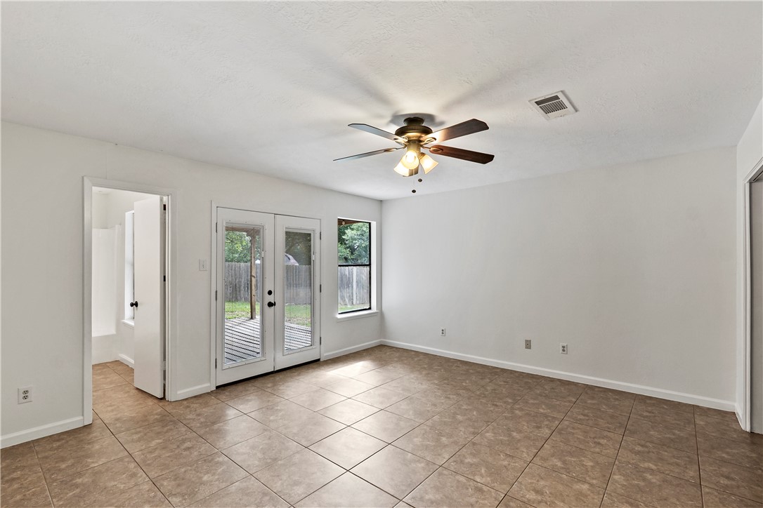 2208 Lobo Drive Bryan, TX 77807 - Photo 18 of 23 a view of an empty room with a fan