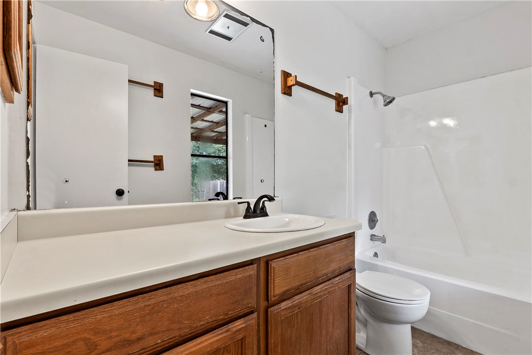 2208 Lobo Drive Bryan, TX 77807 - Photo 20 of 23 a bathroom with a sink a toilet and shower